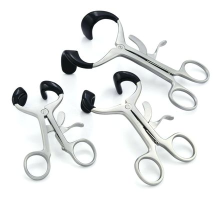 Three Molt mouth gags in different sizes with black rubber tips